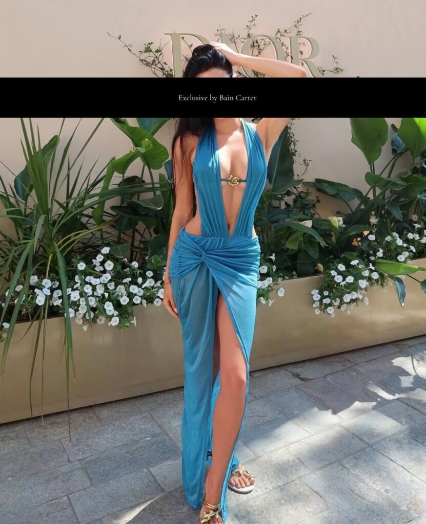 Sophisticated vip companion wearing elegant blue dress with refined luxury escort style