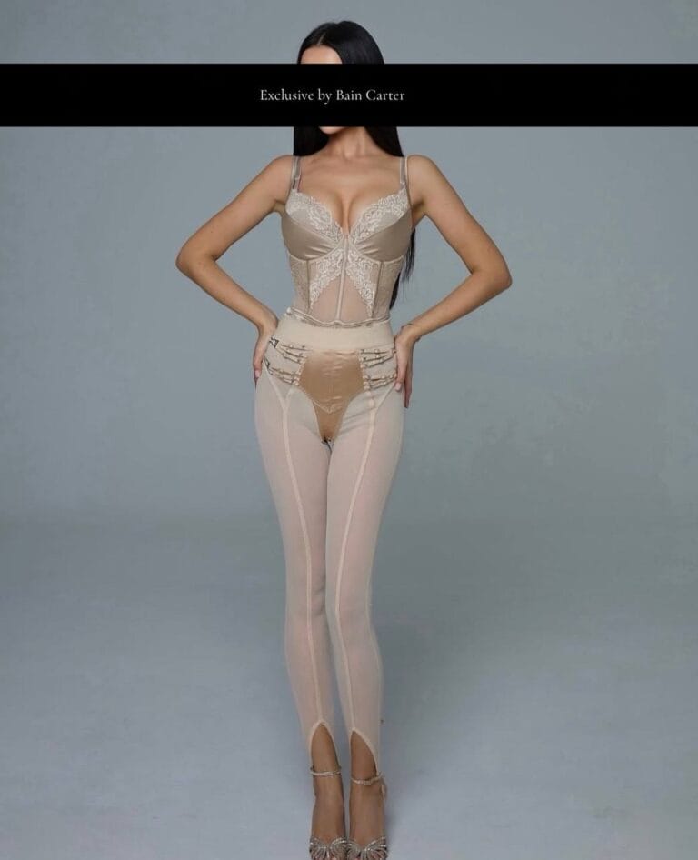 Alina posing in a white outfit