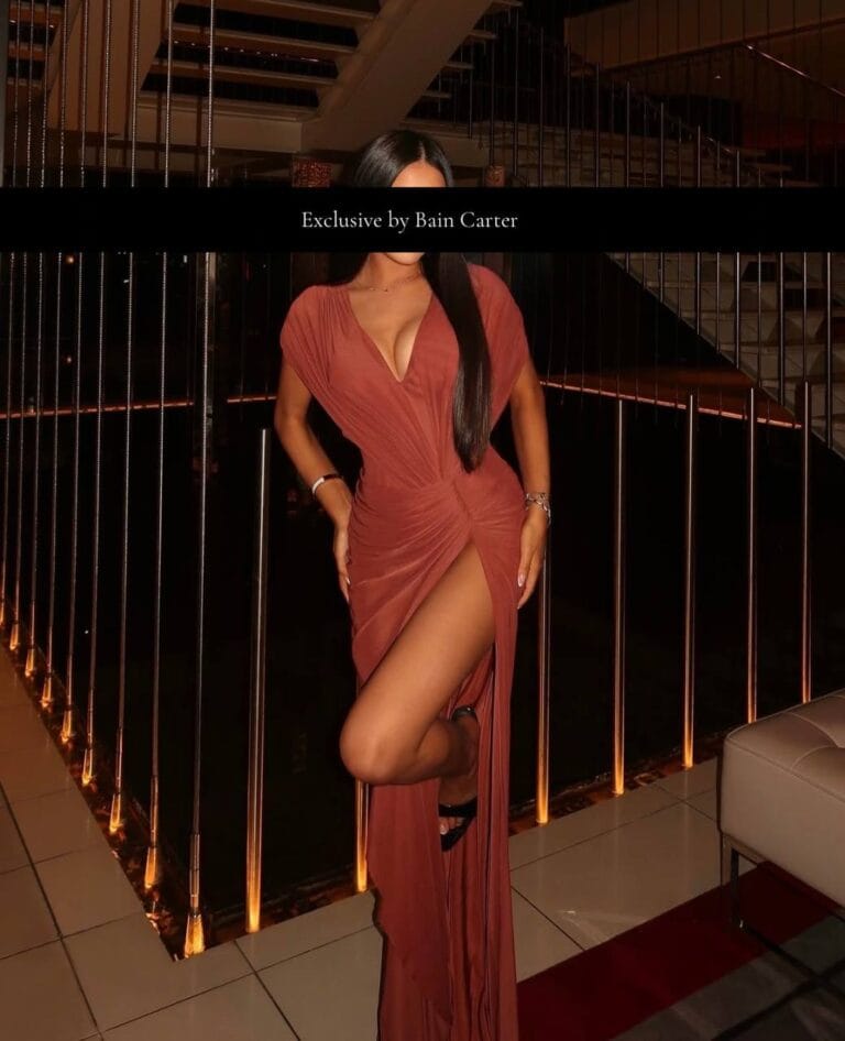 Camilla in a burgundy evening dress