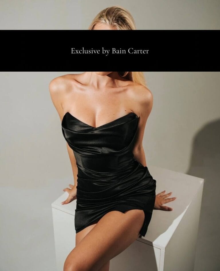 Chloé wearing a black strapless dress in Barcelona