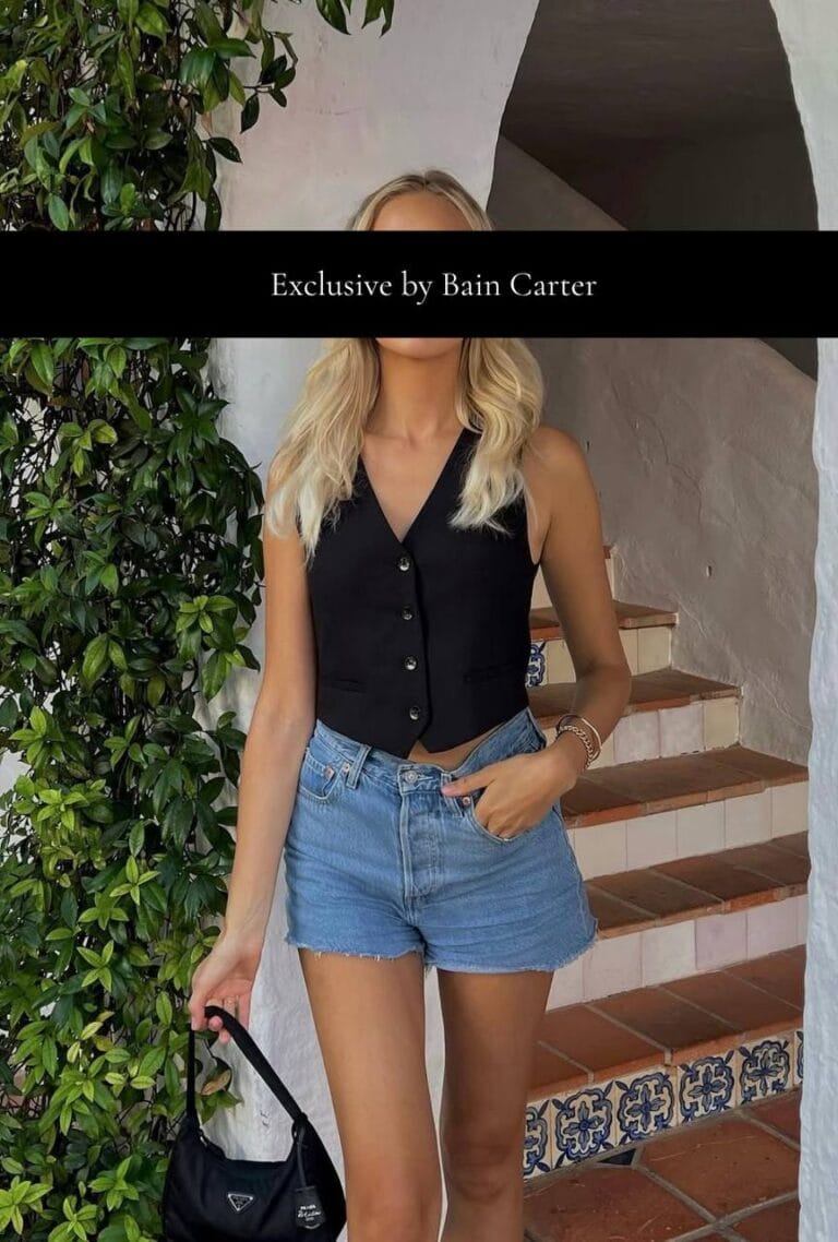 Elsa wearing a black top and denim shorts in Marbella