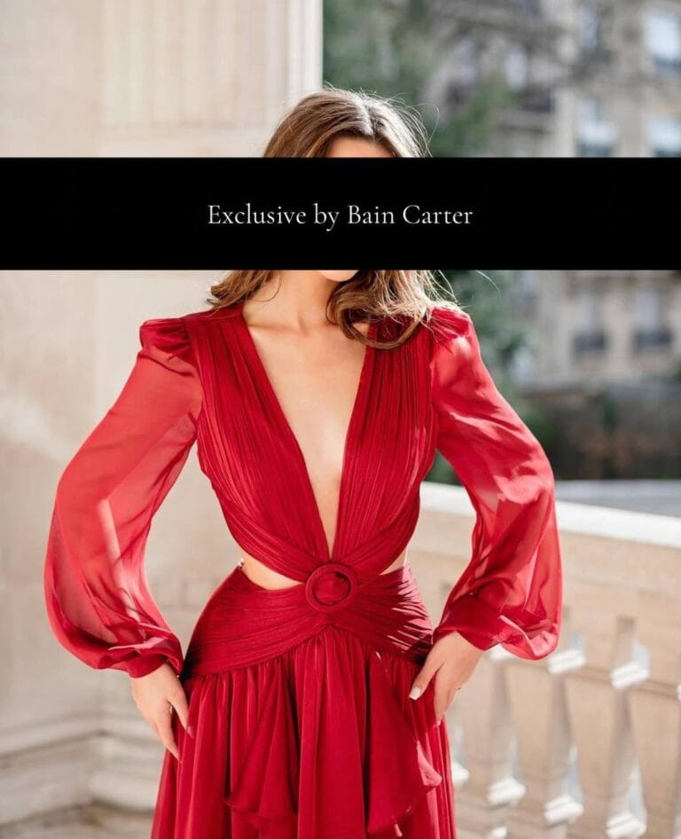 Juliette wearing a flowing red evening dress in Paris.