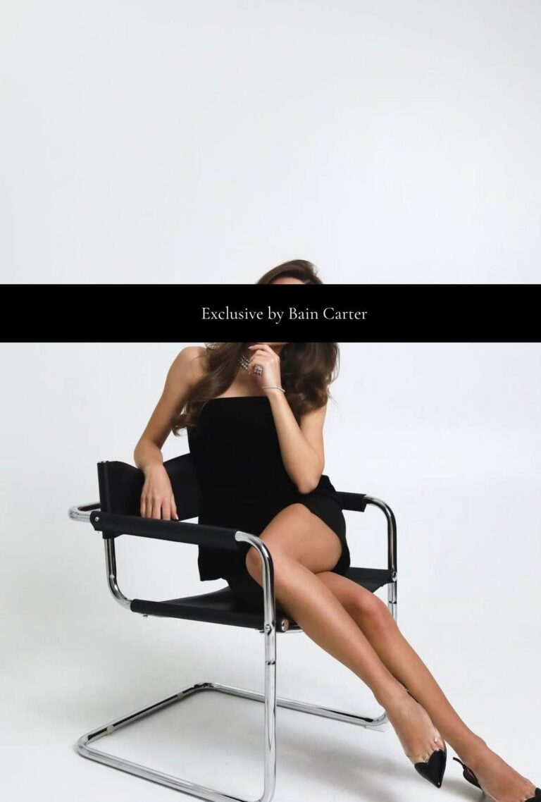 Ludovica sitting on a designer chair