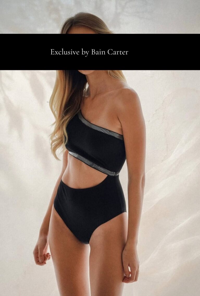 Leonie, blonde escort in London, wearing a black swimsuit