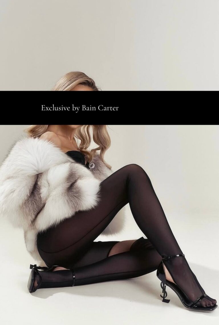 Elizaveta, escort girl in Geneva, wearing a black outfit and heels